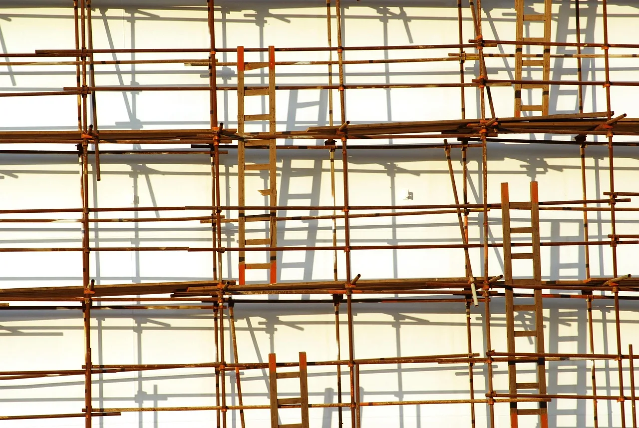 scaffolding, ladder, shadows, scaffolding, scaffolding, scaffolding, scaffolding, scaffolding, ladder. Handyman hiring: roles, qualities, and training order