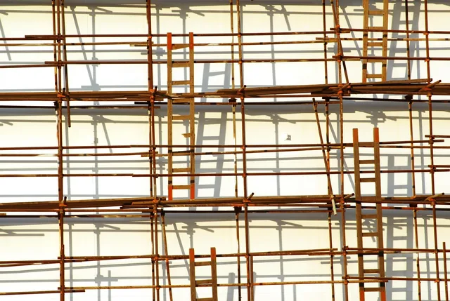 scaffolding, ladder, shadows, scaffolding, scaffolding, scaffolding, scaffolding, scaffolding, ladder. Handyman hiring: roles, qualities, and training order