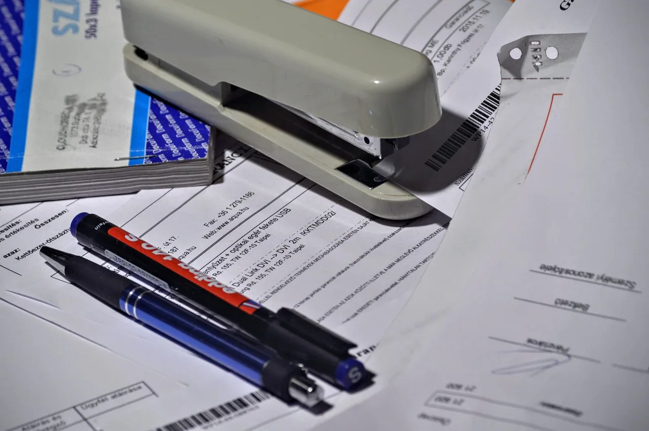 stapler, pen, paperwork, invoice, invoice book, paper, office, accounting, bookkeeper, business, desk, gray business, gray office, gray book, gray books, gray paper, gray desk, gray company, gray accounting, stapler, paperwork, paperwork, paperwork, paperwork, invoice, invoice, invoice, invoice, invoice, accounting, bookkeeper. Handyman invoice records retention: how long to keep task paperwork